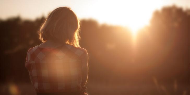 woman watching sunset